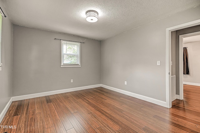 53 Grove Ave, Lebanon, VA 24266 - unfurnished room with a textured ceiling and hardwood / wood-style flooring