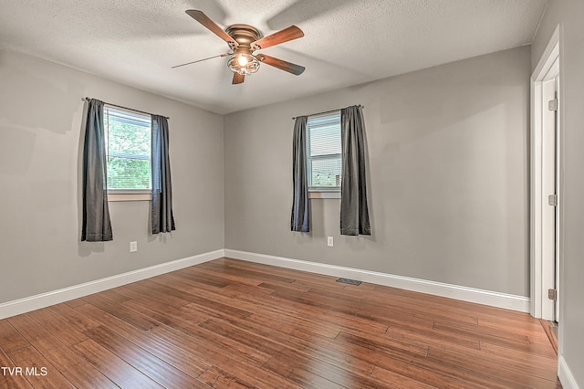 53 Grove Ave, Lebanon, VA 24266 - spare room with a ceiling fan, hardwood / wood-style flooring, and a textured ceiling
