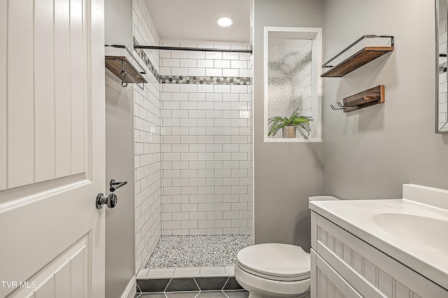 53 Grove Ave, Lebanon, VA 24266 - bathroom featuring tiled shower, vanity, recessed lighting, and tile patterned floors