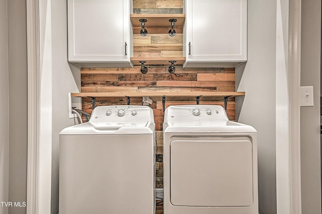53 Grove Ave, Lebanon, VA 24266 - laundry room with separate washer and dryer, cabinet space, and wooden walls