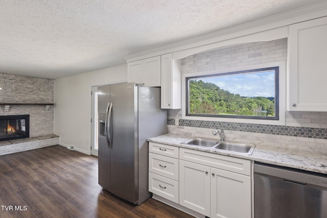 18134 Cleveland Rd, Abingdon, VA 24211 - kitchen featuring stainless steel appliances, a textured ceiling, dark wood-style floors, and white cabinets