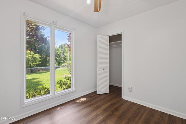 18134 Cleveland Rd, Abingdon, VA 24211 - unfurnished bedroom with dark wood-style flooring, a ceiling fan, and a closet