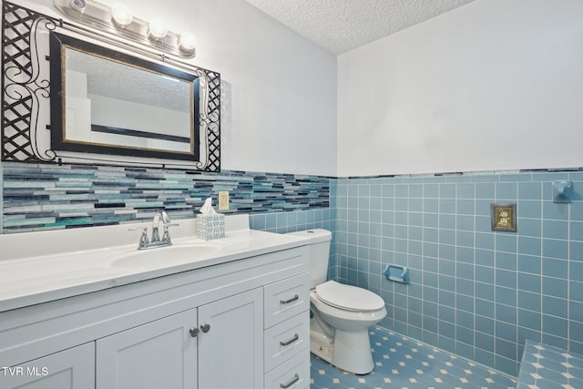 18134 Cleveland Rd, Abingdon, VA 24211 - bathroom with a wainscoted wall, a textured ceiling, and vanity