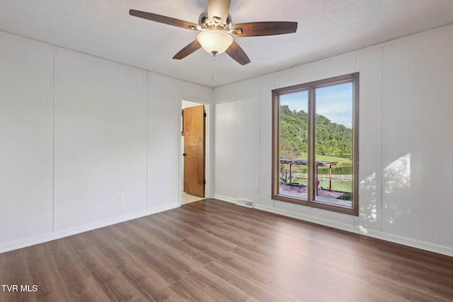18134 Cleveland Rd, Abingdon, VA 24211 - spare room featuring wood finished floors, a ceiling fan, and a decorative wall