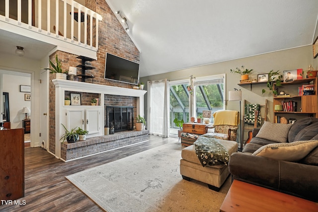 8445 Pendleton Rd, Wise, VA 24293 - living area featuring wood finished floors, a fireplace, and high vaulted ceiling
