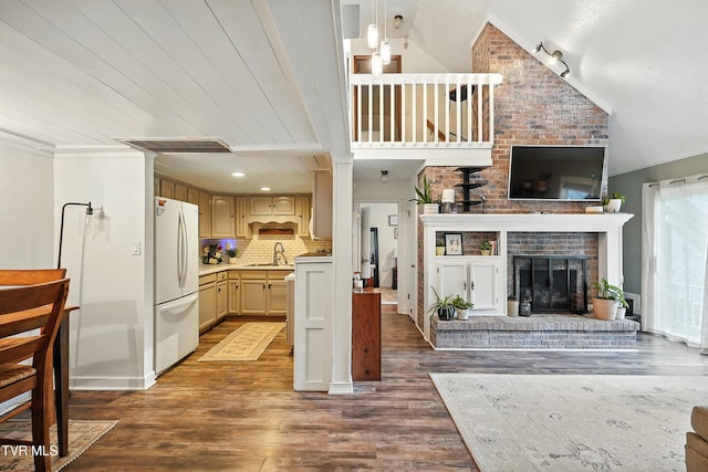 8445 Pendleton Rd, Wise, VA 24293 - living room featuring dark wood finished floors, lofted ceiling, and a brick fireplace