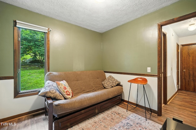 8445 Pendleton Rd, Wise, VA 24293 - sitting room featuring light wood-style flooring and a textured ceiling