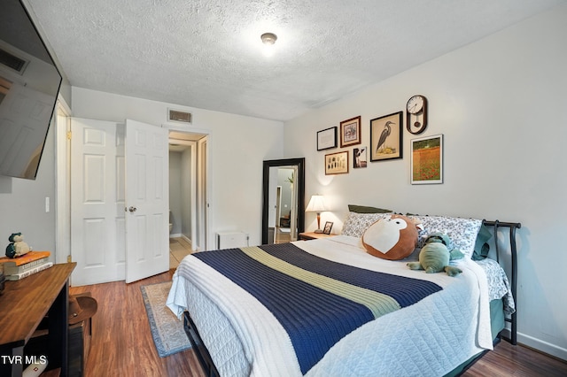 8445 Pendleton Rd, Wise, VA 24293 - bedroom with wood finished floors and a textured ceiling