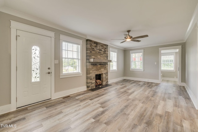 3528 Crestwood Dr, Kingsport, TN 37664 - entryway with crown molding, light wood-style flooring, a stone fireplace, and a ceiling fan
