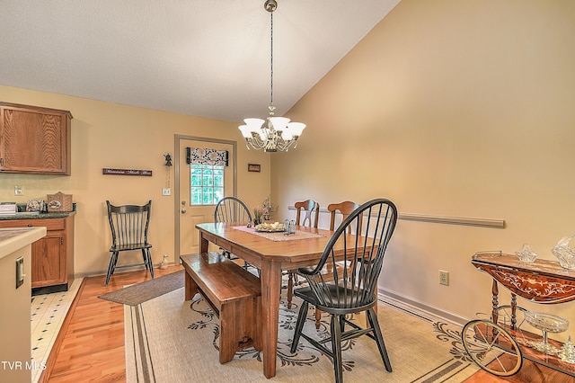 103 Jenny Ln, Jonesborough, TN 37659 - dining space with a chandelier, light wood-type flooring, and vaulted ceiling