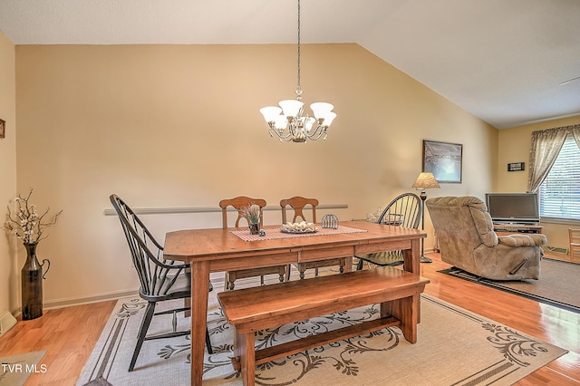 103 Jenny Ln, Jonesborough, TN 37659 - dining room featuring light wood-style flooring, a chandelier, and vaulted ceiling