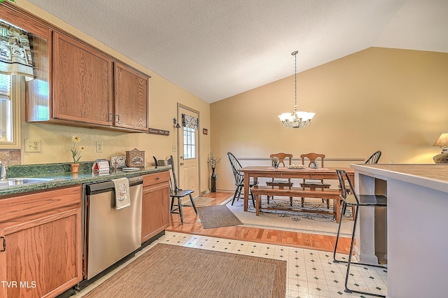 103 Jenny Ln, Jonesborough, TN 37659 - kitchen featuring stainless steel dishwasher, vaulted ceiling, a chandelier, pendant lighting, and light floors