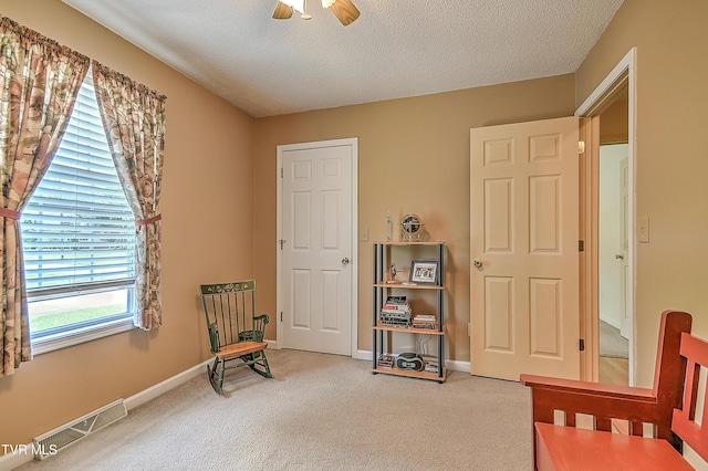 103 Jenny Ln, Jonesborough, TN 37659 - living area with carpet floors, a textured ceiling, and a ceiling fan