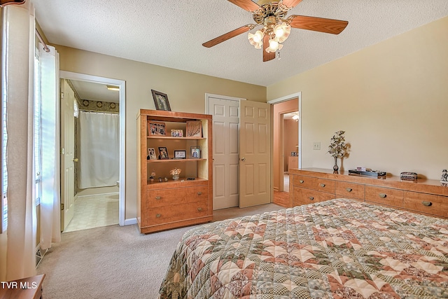 103 Jenny Ln, Jonesborough, TN 37659 - bedroom with light carpet, a textured ceiling, connected bathroom, and ceiling fan