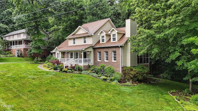 209 Timberland Cir, Kingsport, TN 37664 - view of front of home featuring a porch, a chimney, brick siding, and a front yard