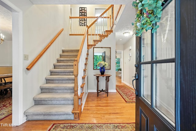 209 Timberland Cir, Kingsport, TN 37664 - entrance foyer with light wood-style floors, stairs, and a chandelier
