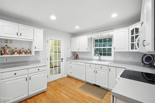 209 Timberland Cir, Kingsport, TN 37664 - kitchen with white appliances, light wood finished floors, white cabinets, recessed lighting, and glass insert cabinets