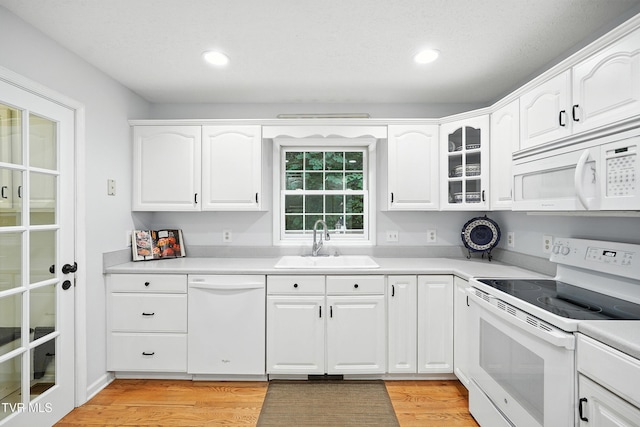 209 Timberland Cir, Kingsport, TN 37664 - kitchen featuring white appliances, light wood finished floors, white cabinets, recessed lighting, and glass insert cabinets