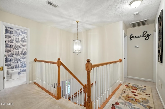 209 Timberland Cir, Kingsport, TN 37664 - hallway with an upstairs landing, a textured ceiling, and light carpet