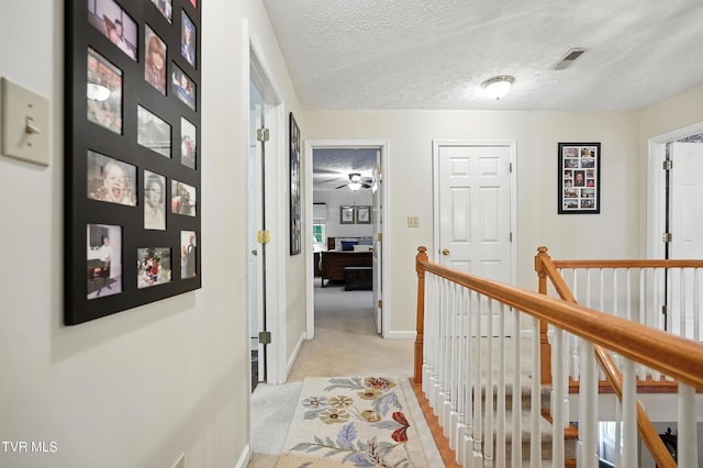 209 Timberland Cir, Kingsport, TN 37664 - corridor featuring light carpet, an upstairs landing, and a textured ceiling