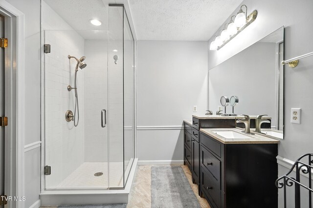 209 Timberland Cir, Kingsport, TN 37664 - bathroom with vanity, a shower stall, a textured ceiling, and recessed lighting