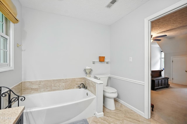 209 Timberland Cir, Kingsport, TN 37664 - bathroom featuring a garden tub, a textured ceiling, a ceiling fan, and vanity