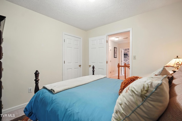 209 Timberland Cir, Kingsport, TN 37664 - carpeted bedroom with a textured ceiling