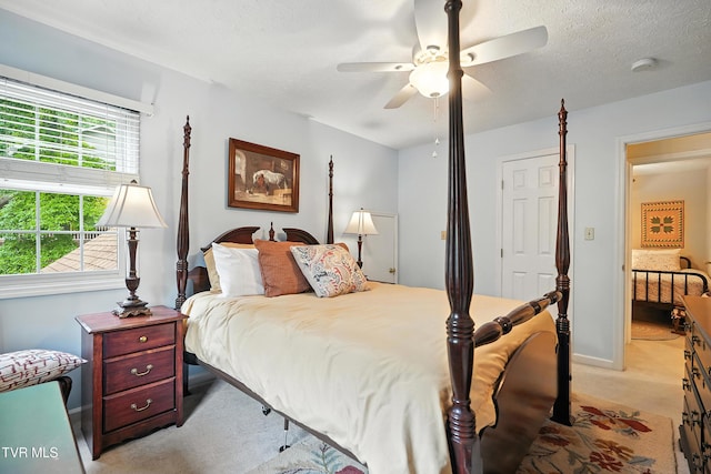 209 Timberland Cir, Kingsport, TN 37664 - bedroom featuring light carpet, a ceiling fan, and a textured ceiling