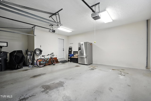 209 Timberland Cir, Kingsport, TN 37664 - garage featuring stainless steel fridge and a garage door opener