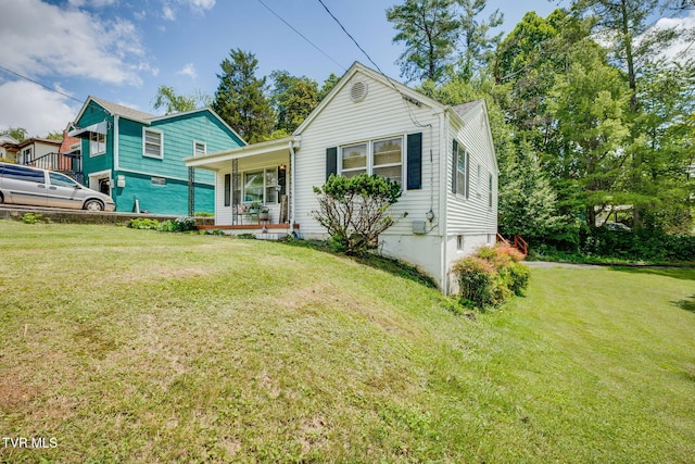 49 24th St, Bristol, TN 37620 - view of front of home featuring covered porch and a front lawn