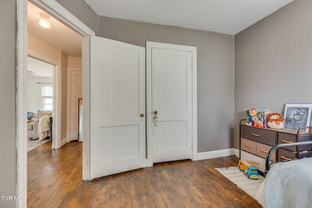 49 24th St, Bristol, TN 37620 - bedroom featuring dark wood-style floors and baseboards