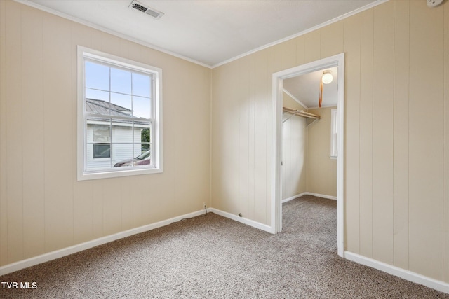 1449 E Sevier Ave, Kingsport, TN 37664 - unfurnished bedroom featuring a walk in closet, carpet floors, crown molding, and a closet