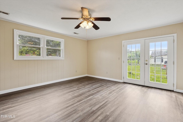 1449 E Sevier Ave, Kingsport, TN 37664 - unfurnished room with wood finished floors, french doors, a ceiling fan, and crown molding
