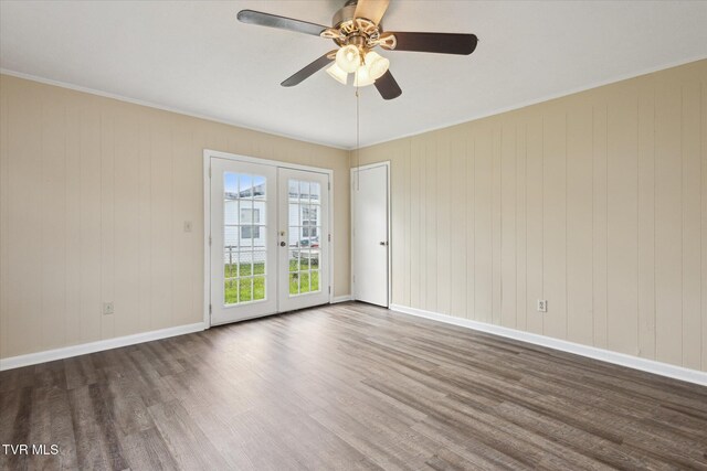 1449 E Sevier Ave, Kingsport, TN 37664 - empty room featuring wood finished floors, ceiling fan, french doors, and ornamental molding