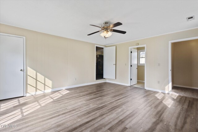 1449 E Sevier Ave, Kingsport, TN 37664 - spare room featuring a ceiling fan, crown molding, and wood finished floors