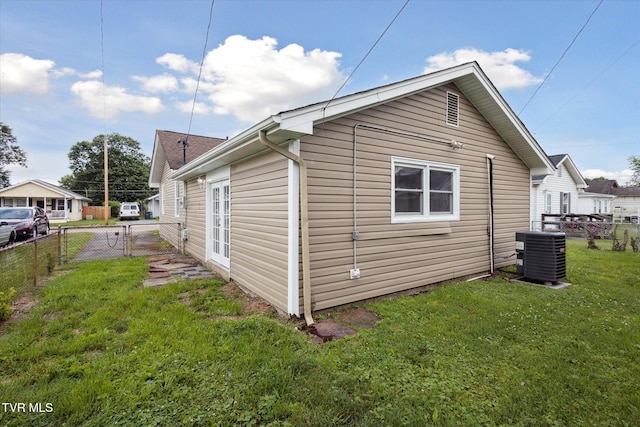 1449 E Sevier Ave, Kingsport, TN 37664 - view of side of home with a central AC unit and a gate