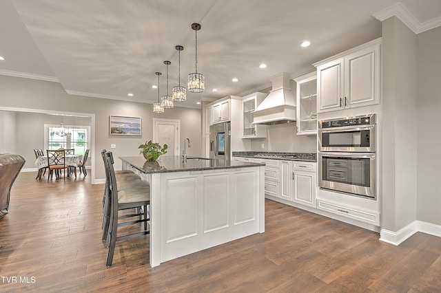 20385 Yeary Trl, Abingdon, VA 24211 - kitchen featuring custom range hood, a chandelier, appliances with stainless steel finishes, ornamental molding, and a center island with sink