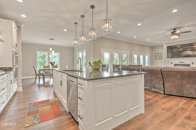 20385 Yeary Trl, Abingdon, VA 24211 - kitchen featuring ornamental molding, stainless steel dishwasher, recessed lighting, a center island with sink, and a ceiling fan