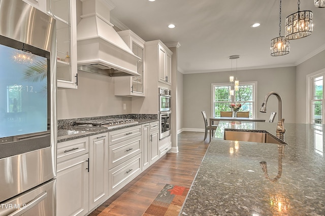 20385 Yeary Trl, Abingdon, VA 24211 - kitchen featuring custom exhaust hood, appliances with stainless steel finishes, crown molding, glass insert cabinets, and white cabinets