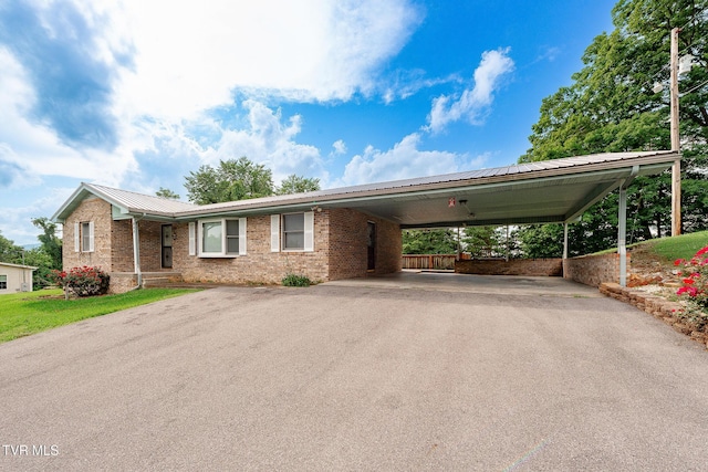 110 Richard Ln, Fall Branch, TN 37656 - view of front of property with asphalt driveway, a metal roof, brick siding, and a carport