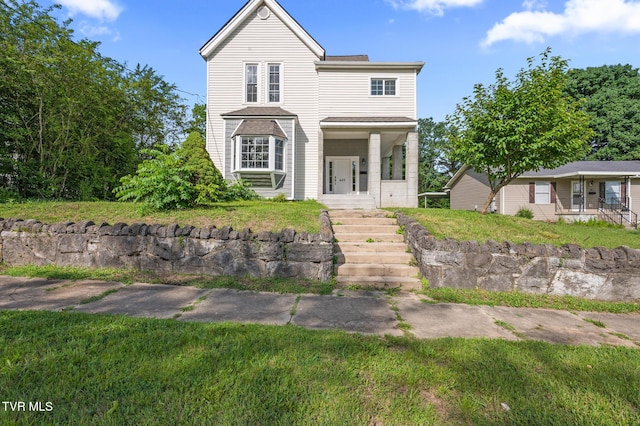 409 Pennsylvania Ave, Bristol, TN 37620 - traditional home featuring a porch and a front lawn