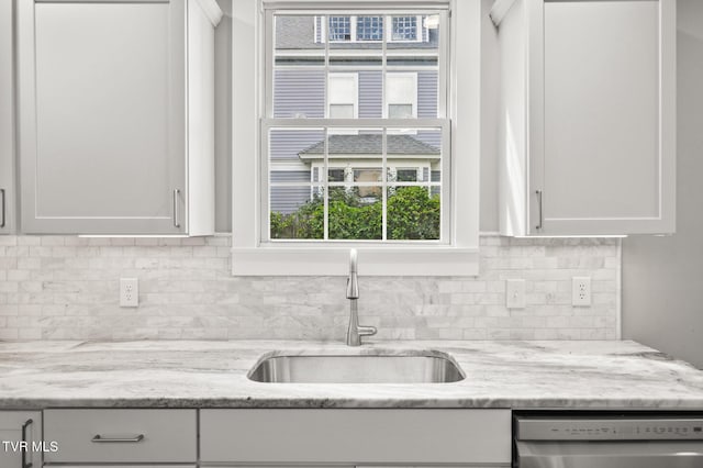409 Pennsylvania Ave, Bristol, TN 37620 - kitchen with dishwasher, white cabinets, healthy amount of natural light, and tasteful backsplash