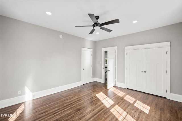 409 Pennsylvania Ave, Bristol, TN 37620 - unfurnished bedroom with dark wood-type flooring, recessed lighting, a ceiling fan, and multiple closets