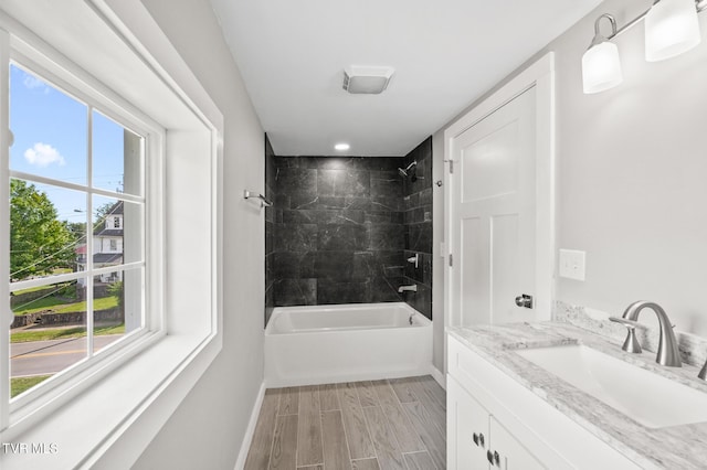 409 Pennsylvania Ave, Bristol, TN 37620 - full bathroom with vanity, shower / bathtub combination, and wood finished floors