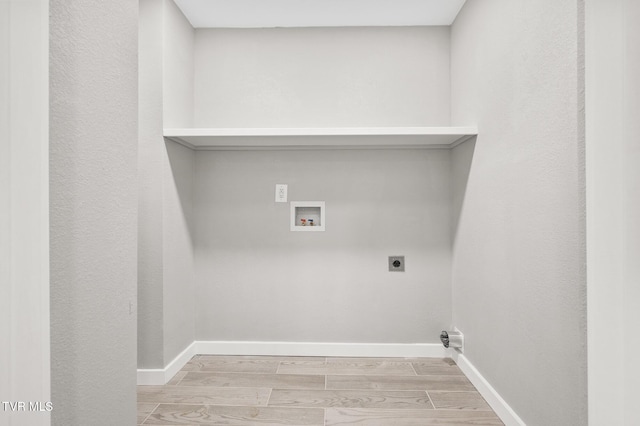 409 Pennsylvania Ave, Bristol, TN 37620 - laundry room with hookup for an electric dryer, light wood-type flooring, and washer hookup