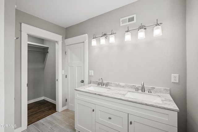 409 Pennsylvania Ave, Bristol, TN 37620 - bathroom with double vanity and wood finished floors