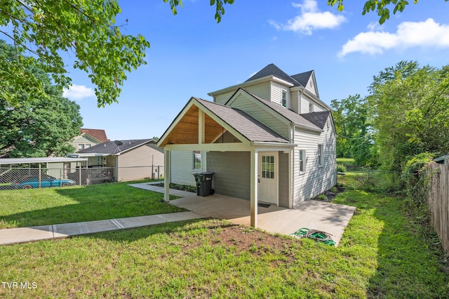 409 Pennsylvania Ave, Bristol, TN 37620 - back of property featuring a patio area, a shingled roof, and a fenced backyard