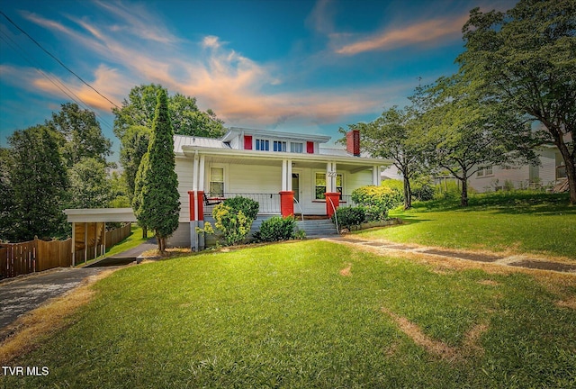 227 Jonesboro Dr, Bluff City, TN 37618 - view of front of property featuring a porch, a chimney, a metal roof, a carport, and a standing seam roof