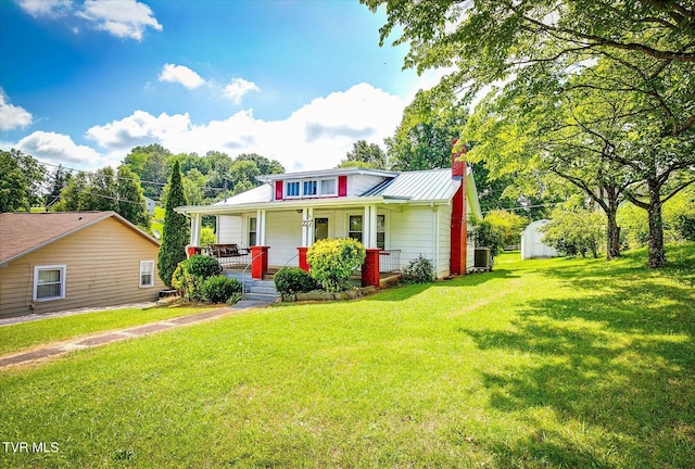 227 Jonesboro Dr, Bluff City, TN 37618 - bungalow with covered porch, a chimney, a front lawn, and a metal roof