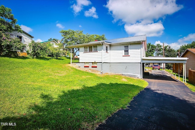 227 Jonesboro Dr, Bluff City, TN 37618 - view of front of property with a front lawn, a metal roof, asphalt driveway, and an attached carport